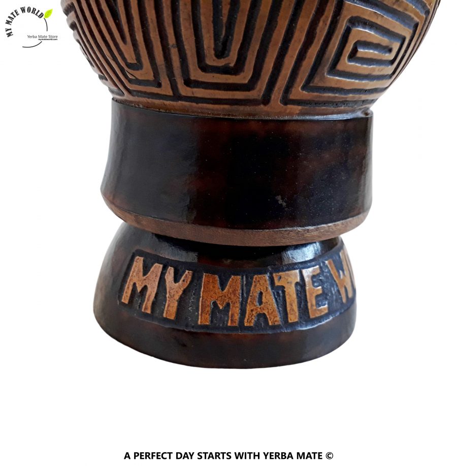 Handcarved Yerba Mate Gourd in hand. Abstract geometric pattern.